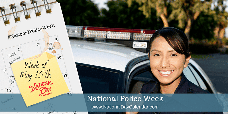 Apartments in Northwest Houston North A police officer is standing next to a calendar showcasing National Police Week.