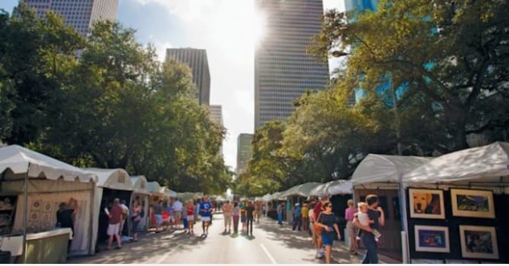 Apartments in Northwest Houston North         Description: A lively street in NW Houston North filled with colorful tents and bustling with people strolling through the area.