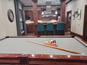 Apartments for rent in Northwest Houston, Texas - Clubroom Pool Table with View to Kitchen with Breakfast Bar
