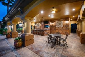 Apartments for Rent in Northwest Houston, TX - Outdoor Covered Patio with Seating at Night