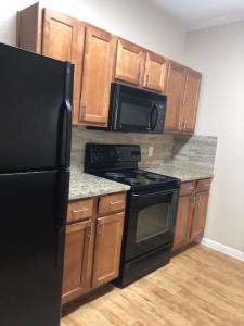 One Bedroom Apartments in NW Houston, Texas - Apartment Galley Kitchen with Granite Countertops