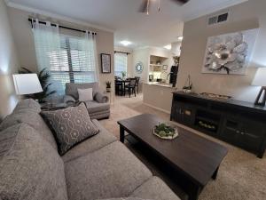 One Bedroom Apartments in Northwest Houston, Texas - Model Living Room with View to Kitchen and Dining Room